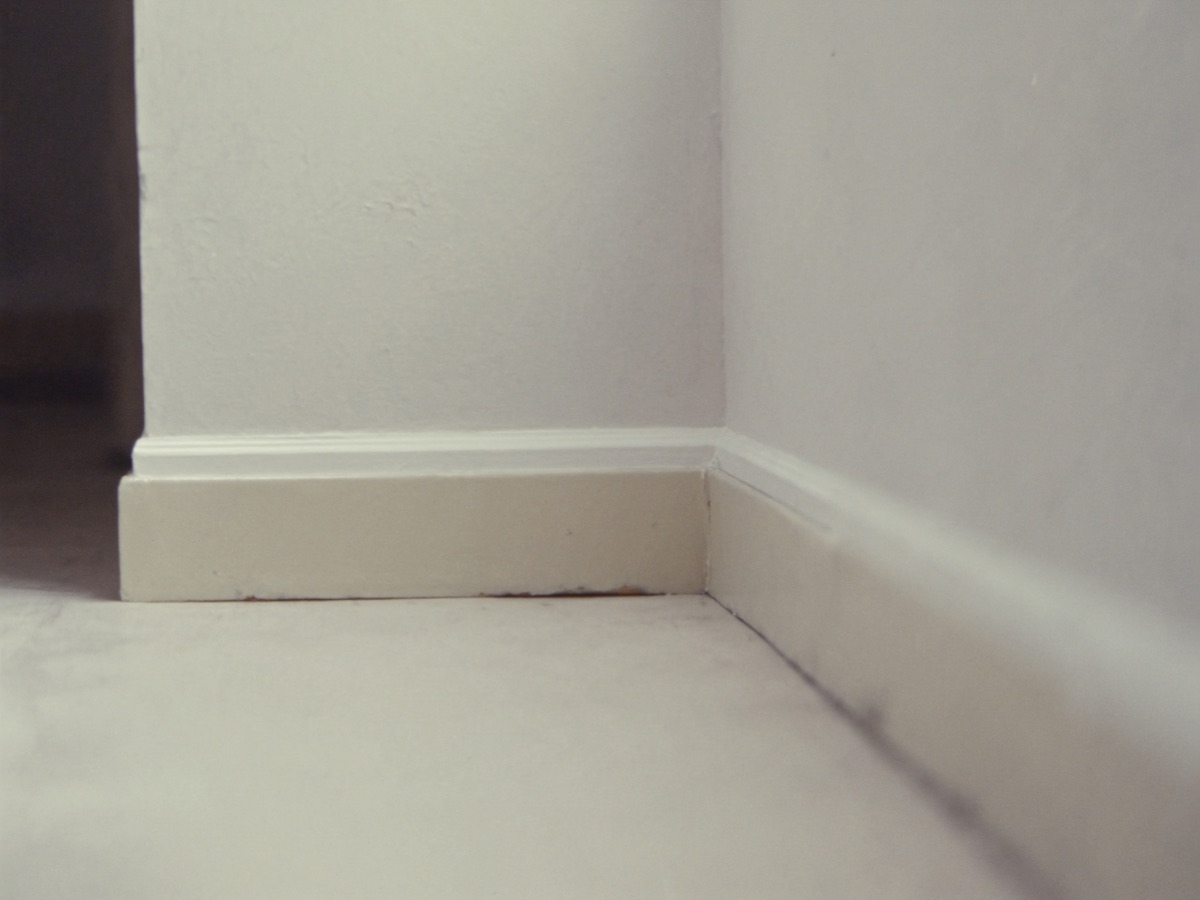 Sample inspection photograph: a close-up of an interior wall corner and skirting board, used to illustrate photo evidence in this demo.
